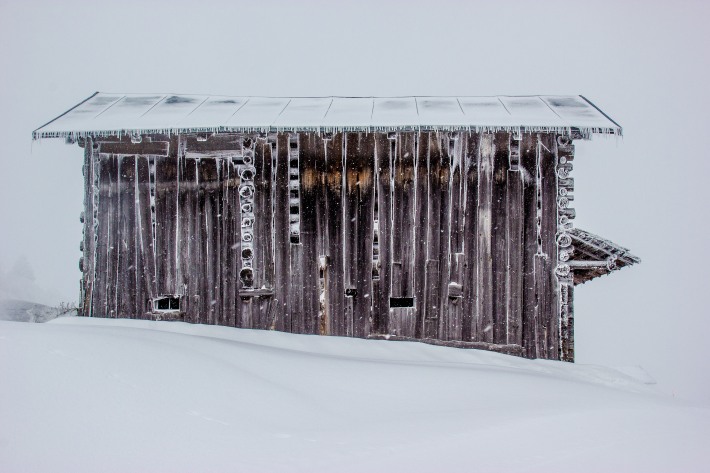 I am extremely cold: A view of a frozen, snow-covered barn in the Swiss Alps.
